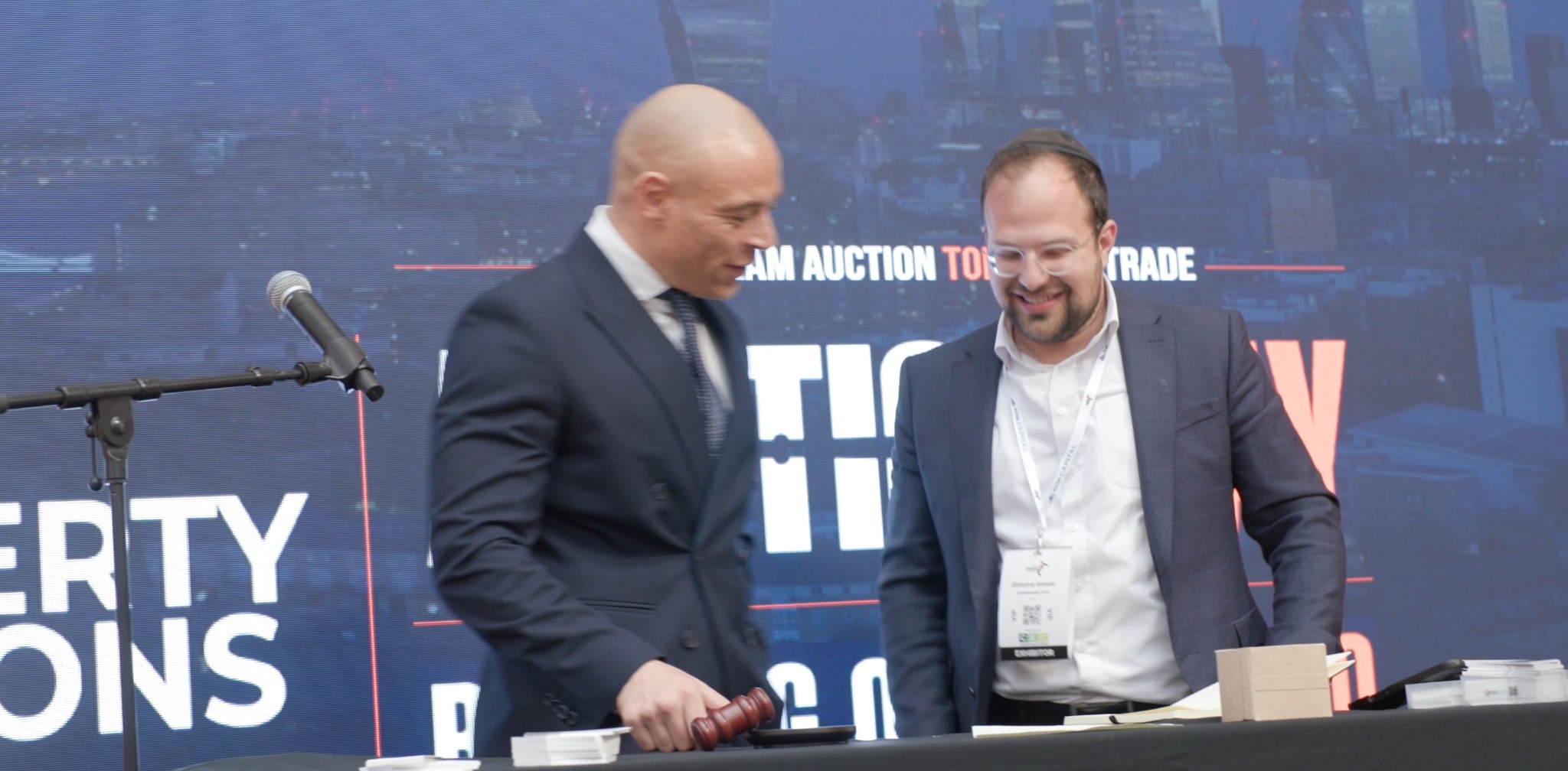 Charles Thomas with a colleague at the auction rostrum