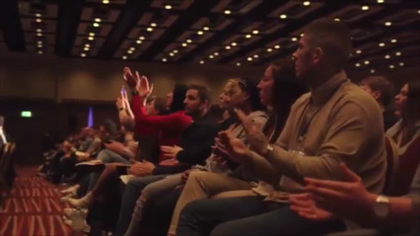An audience applauding at an event